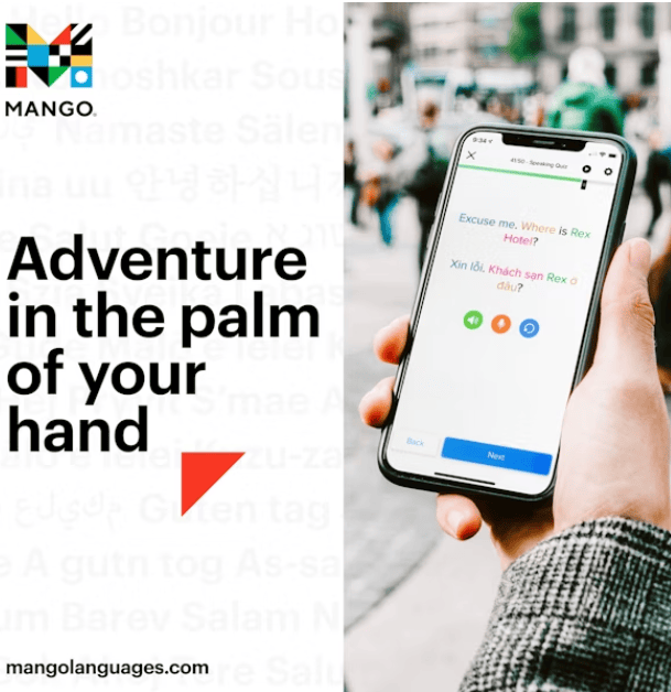 A person holds a smartphone displaying a language translation app. Text reads, Adventure in the palm of your hand. The Mango Languages logo appears at the top left. The background is a blurred outdoor scene.