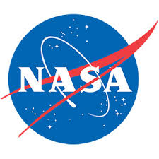 NASA logo featuring a blue circle with white stars, white letters spelling NASA, a red chevron-shaped wing, and a white orbital path swooping around the text.